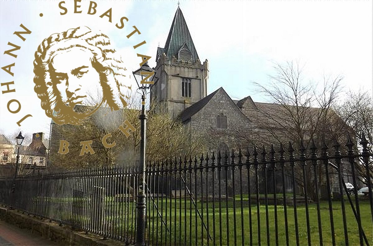 A stone church with a tall steeple and arched windows behind a black iron fence stands as St. Nicholas’ Collegiate Church. Overlaid is a sepia illustration of Johann Sebastian Bach’s face with his name in large curved text.